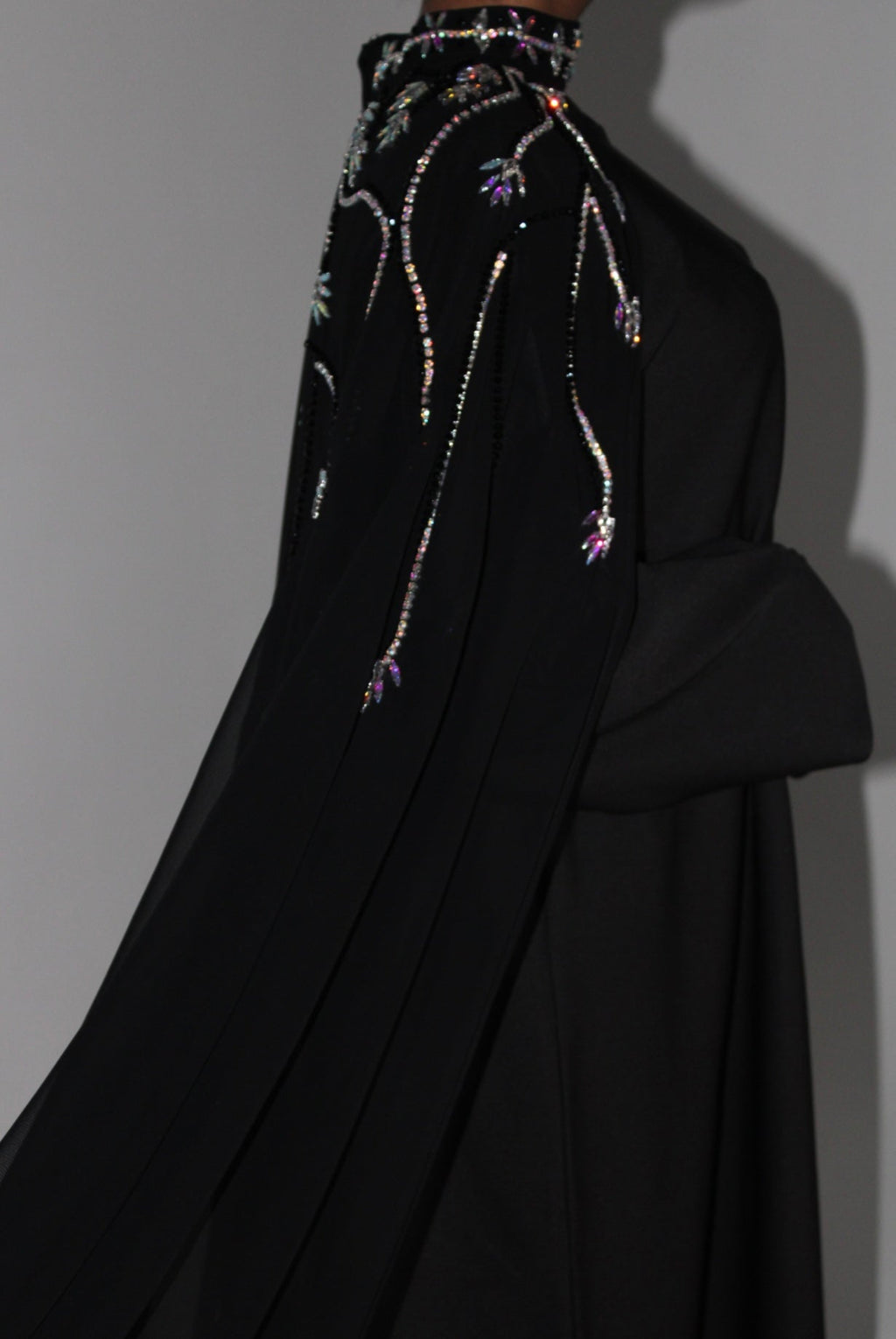 Black abaya embroidered garment on a plain background