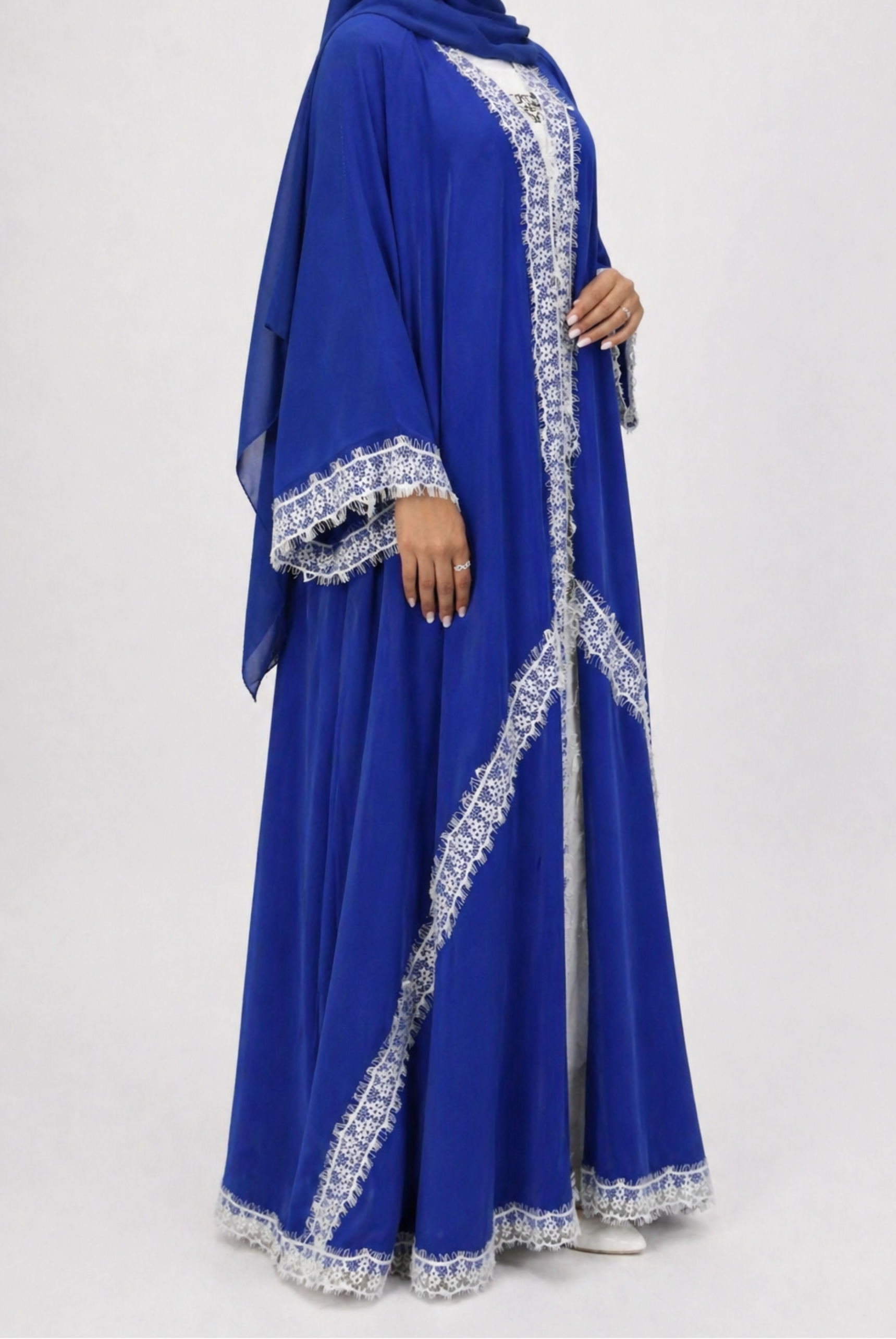 Blue dress with white embroidery on a white background