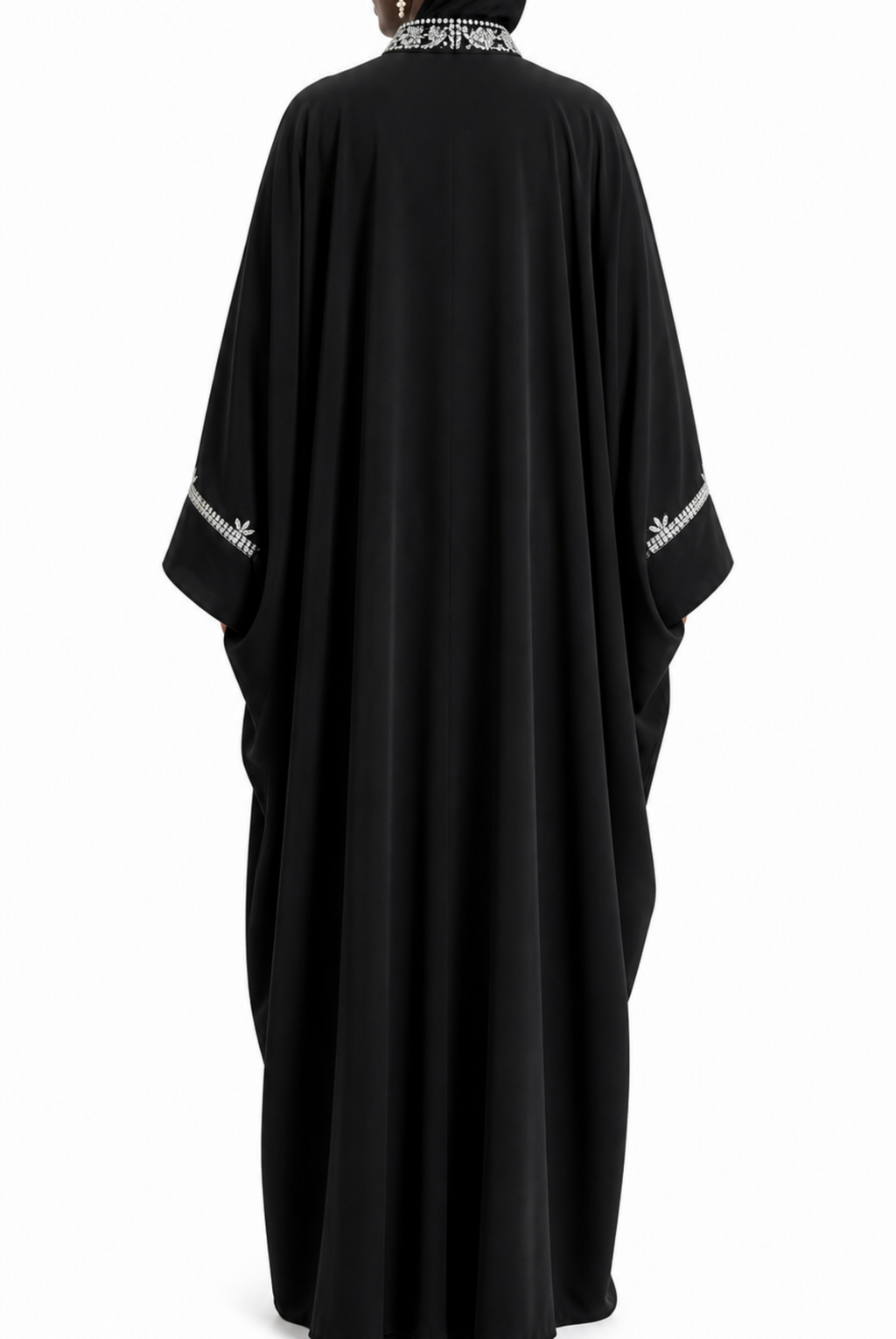 Black abaya with white embroidery on a white background