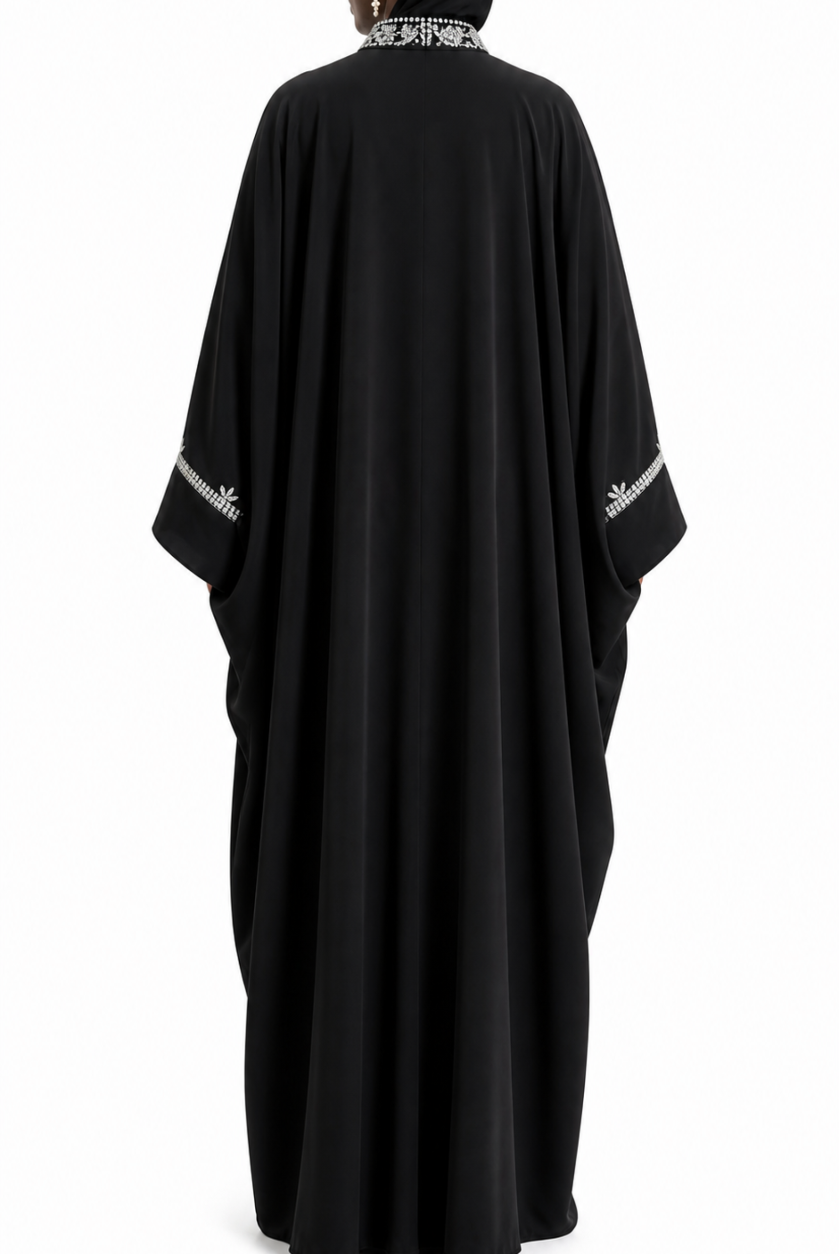 Black abaya with white embroidery on a white background