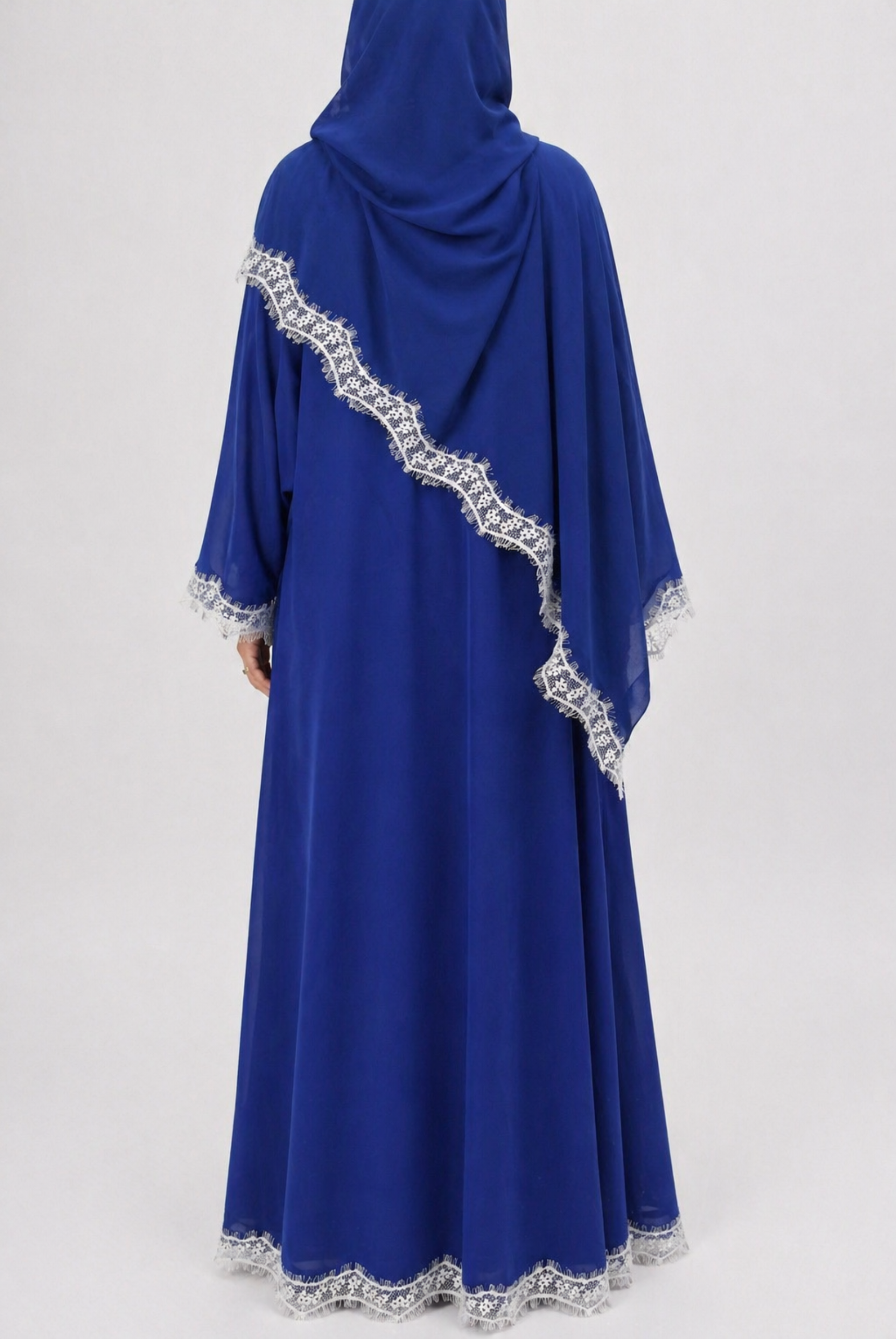 Blue abaya with white lace details on a white background