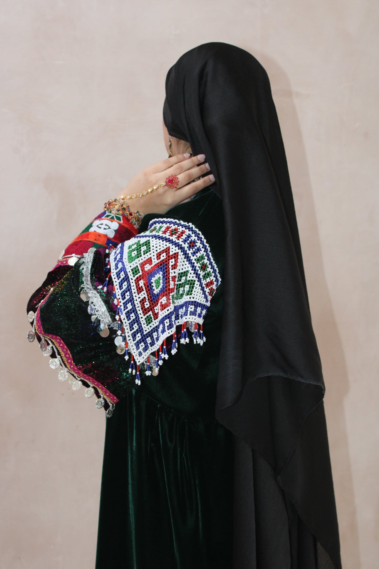 Traditional embroidered outerwear with colorful patterns on a plain background