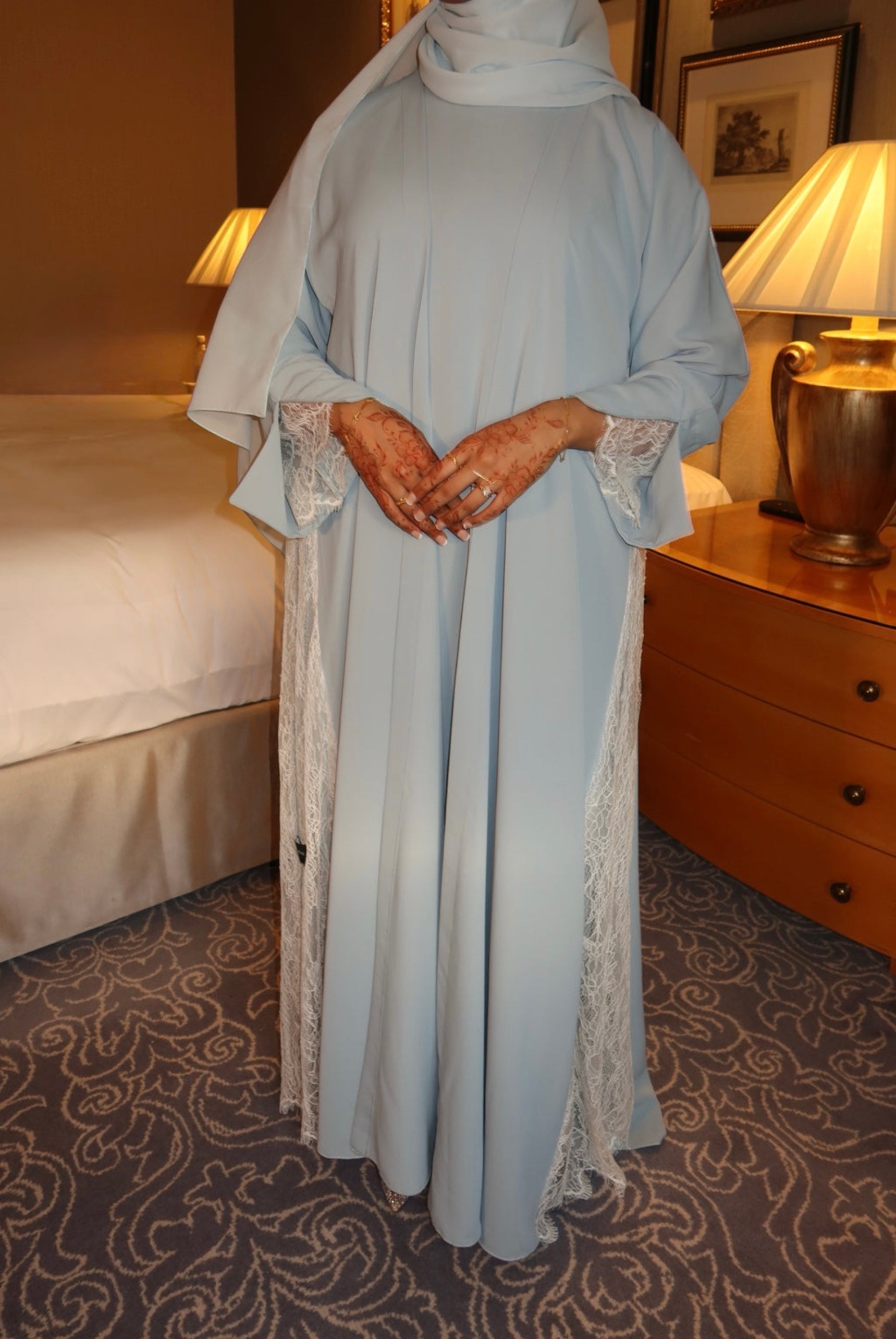 Person wearing a light blue abaya.